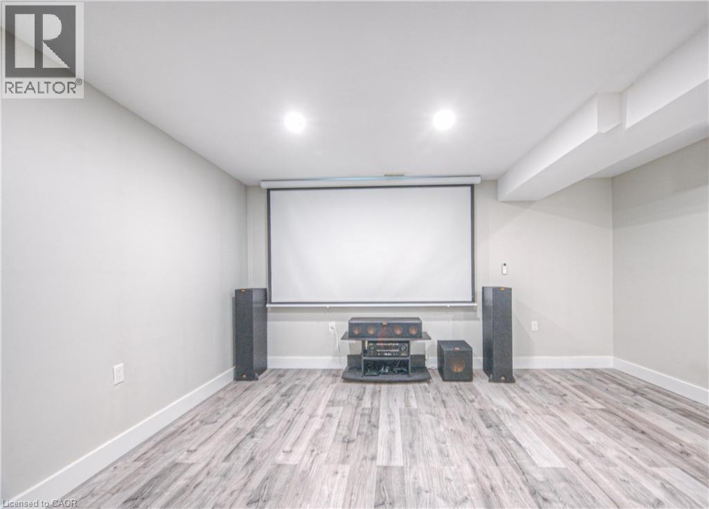 Cinema with light wood finished floors and recessed lighting - 220 Sienna Crescent, Kitchener, ON - Indoor Photo Showing Other Room With Fireplace