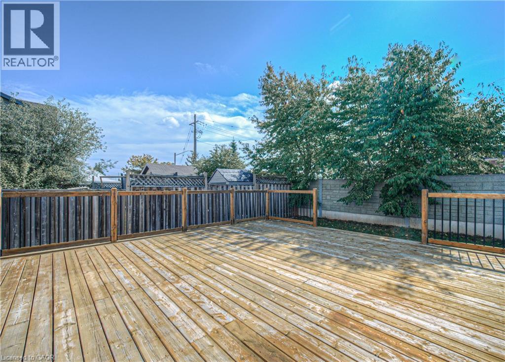 Wooden deck with a fenced backyard - 220 Sienna Crescent, Kitchener, ON - Outdoor With Deck Patio Veranda