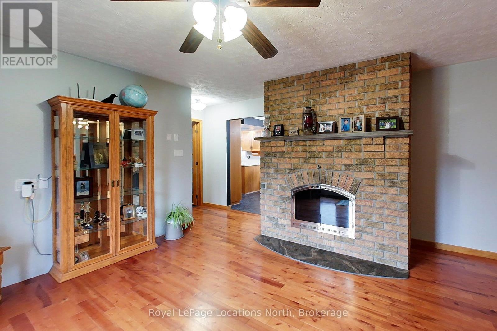 Walk out to Upper Deck from Living Room - 137794 Grey Rd 12 Road S, Meaford, ON - Indoor With Fireplace