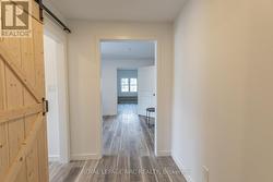 Hallway with Barn door to Bathroom -
