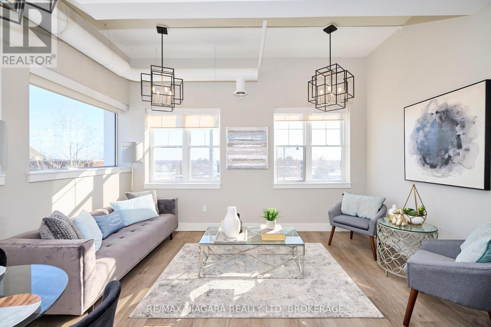 Living Room with Oversized Windows - 201 - 1440 Pelham Street, Pelham (Fonthill), ON