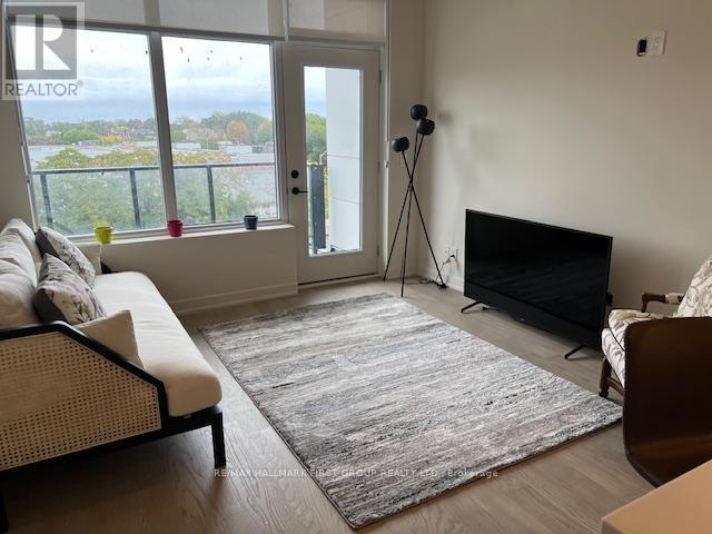 407 - 123 Maurice Drive, Oakville, ON - Indoor Photo Showing Living Room With Fireplace