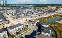 Aerial view of residential area with a nearby body of water -