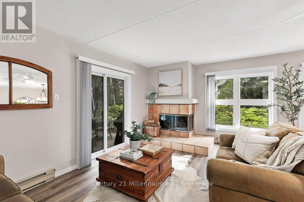 24 - 409 Mariners Way, Collingwood, ON - Indoor Photo Showing Living Room With Fireplace