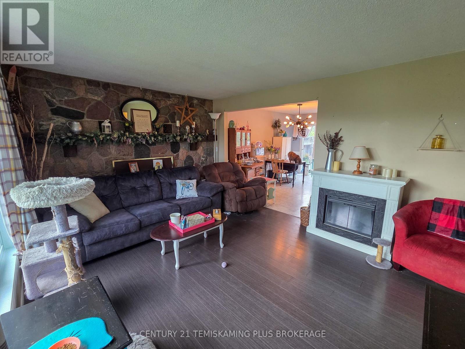 Main Floor Living Room - 47 Eighth Avenue, Englehart, ON - Indoor Photo Showing Living Room With Fireplace