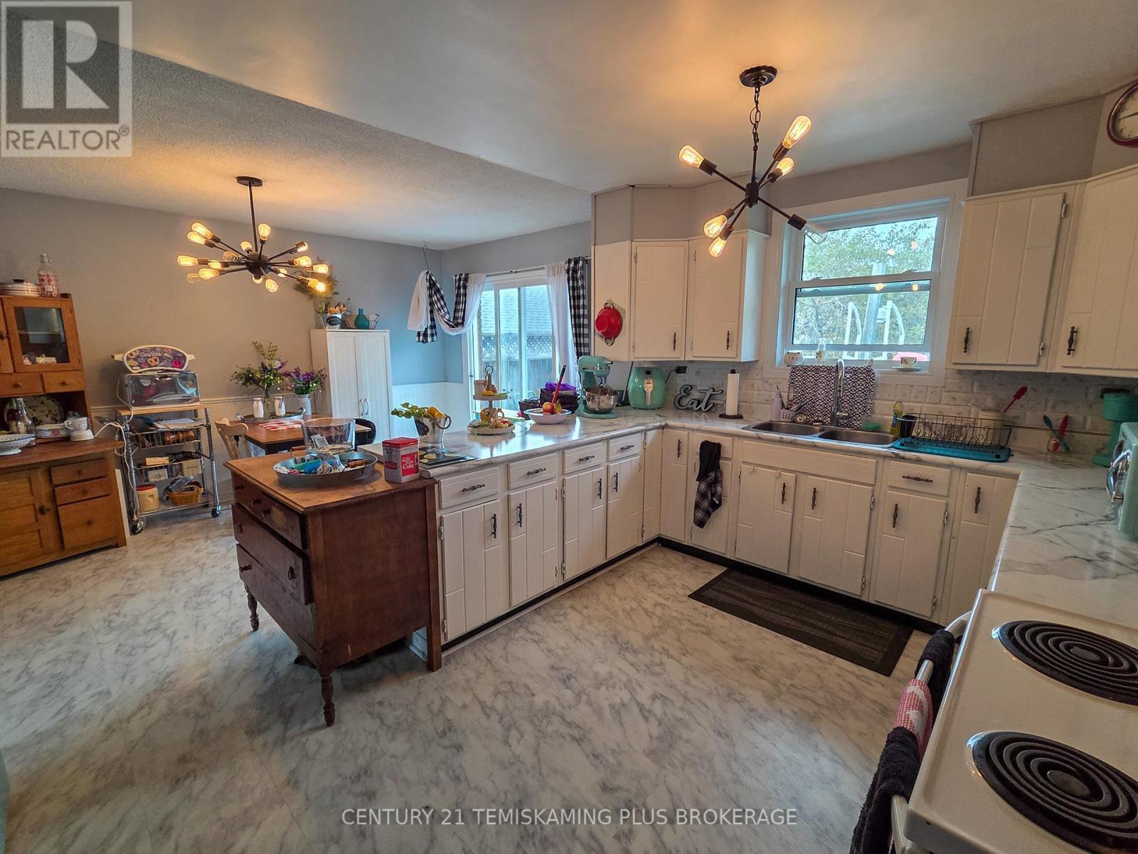 Main Floor Kitchen & Dining Area - 47 Eighth Avenue, Englehart, ON - Indoor Photo Showing Kitchen With Double Sink