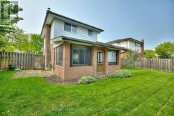 Rear of home showing screened in Sun Room -