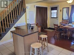 Kitchen with a view into the dining room. -