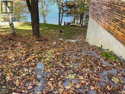 Screw Piles run across the side of the cottage -