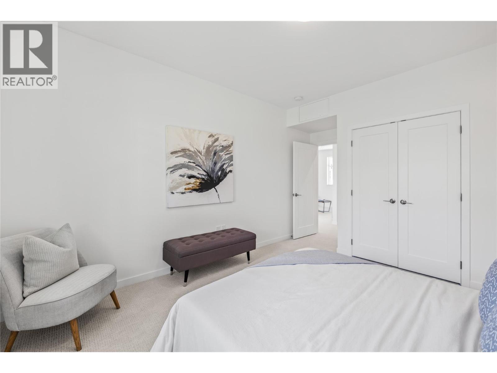 Photo of a similar home in the community. - 1979 Country Club Drive Unit# 6, Kelowna, BC - Indoor Photo Showing Bedroom