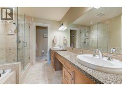 Primary ensuite - 5 pc. Dual vanities, granite counters, tile/glass shower, tub and heated floors -