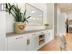 Custom designed sideboard with storage shelving and drawers, shiplap wall detail and quartz counter. -