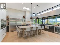 The beautifully balanced and custom designed kitchen is the heart of the home -