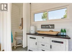 Shiplap and concrete interior, large windows, full size fridge, plus a change area -