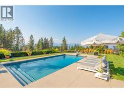 Surrounded by poured concrete and manicured lawn, the pool was designed for leisurely afternoons soaking up the okanagan sunshine -