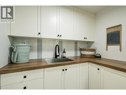 Convenient SS sink in laundry room -