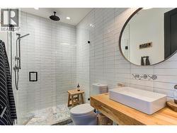 Main level full guest bathroom with easy exterior access from the pool area -