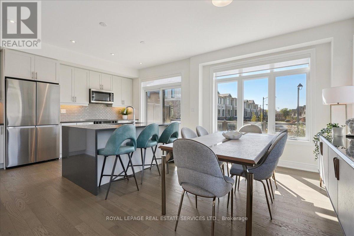 Modern kitchen with extended white cabinetry - 2180 Postmaster Drive, Oakville, ON - Indoor Photo Showing Other Room