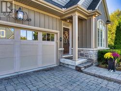 Double car garage and interlock driveway. -