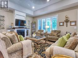 Family room with large windows for natural light. -