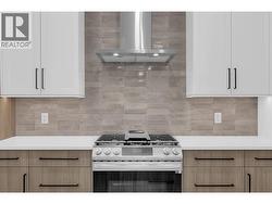 Kitchen - Photos are of a similar home, same floor plan, alternate colour scheme -