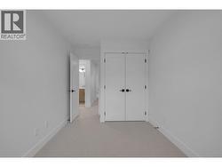 Second bedroom - Primary - Photos are of a similar home, same floor plan, alternate colour scheme -
