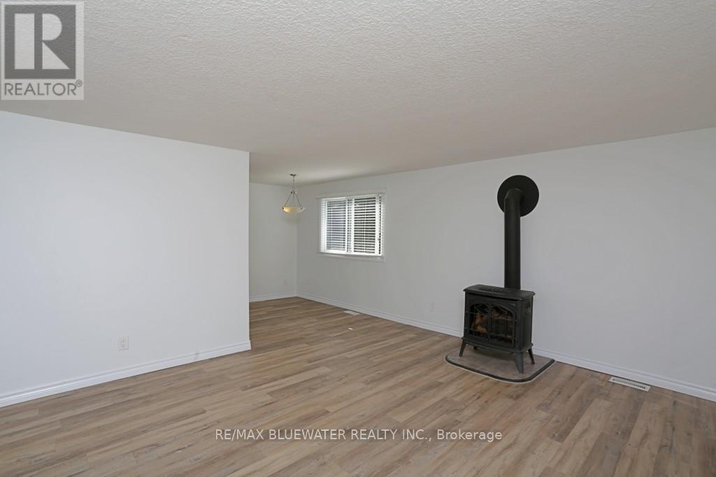23 Pebble Beach Parkway, South Huron (Stephen), ON - Indoor With Fireplace