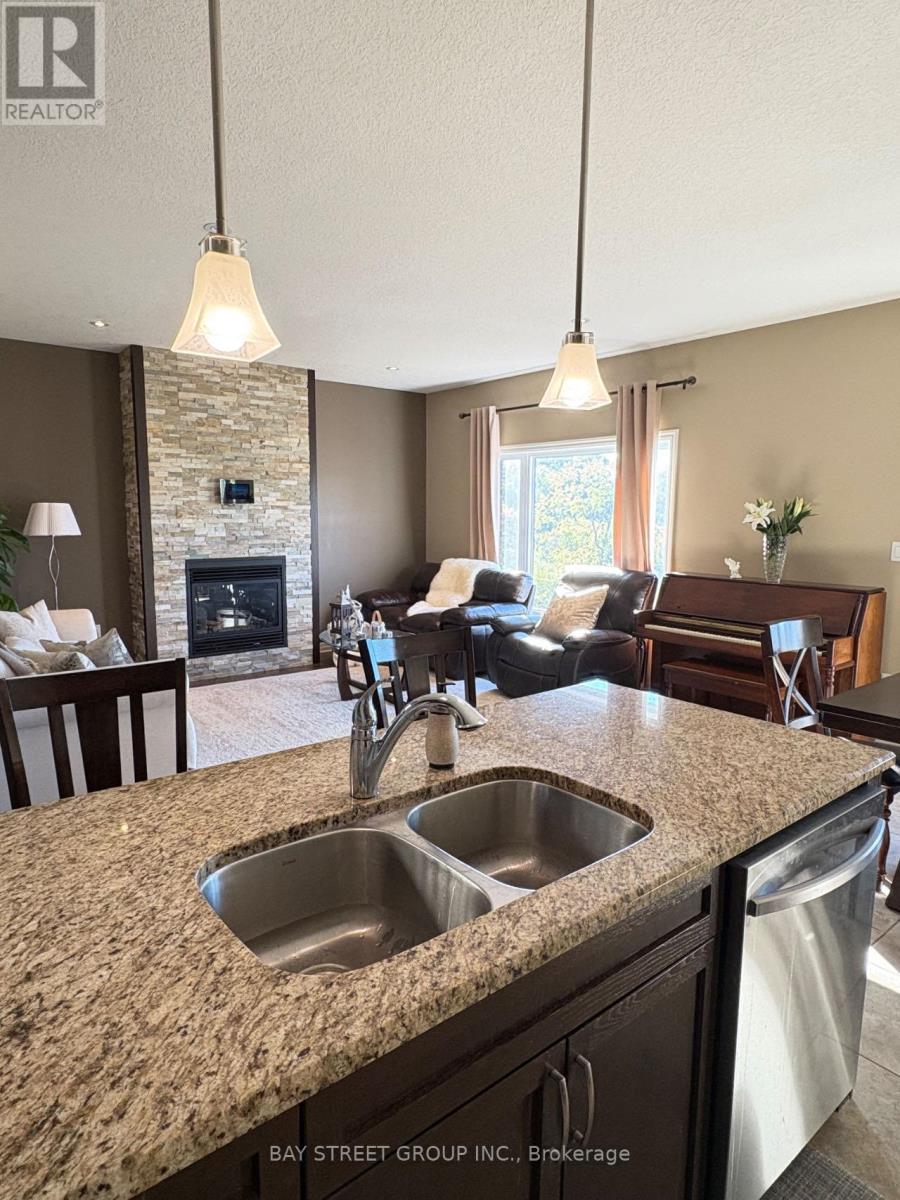 1451 Howlett Circle, London North, ON - Indoor Photo Showing Kitchen With Fireplace With Double Sink