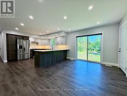 Open Dining area with walk-out to backyard. -