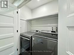 Separate laundry off hallway area. -