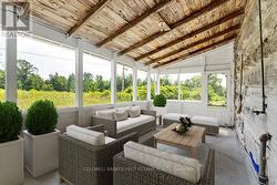 Cottage Screened Porch. Image is virtually staged -