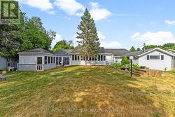 Back yard has four powered sheds. -