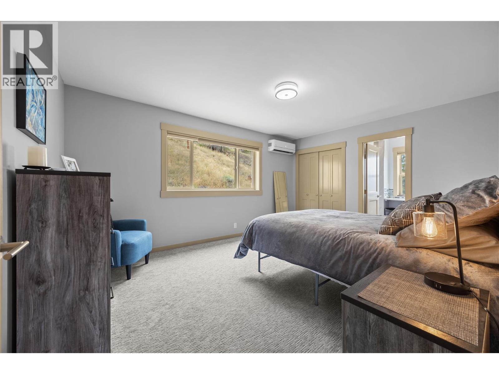 One of two bedrooms on main floor - 432 Hwy 97 Highway, Summerland, BC - Indoor Photo Showing Bedroom