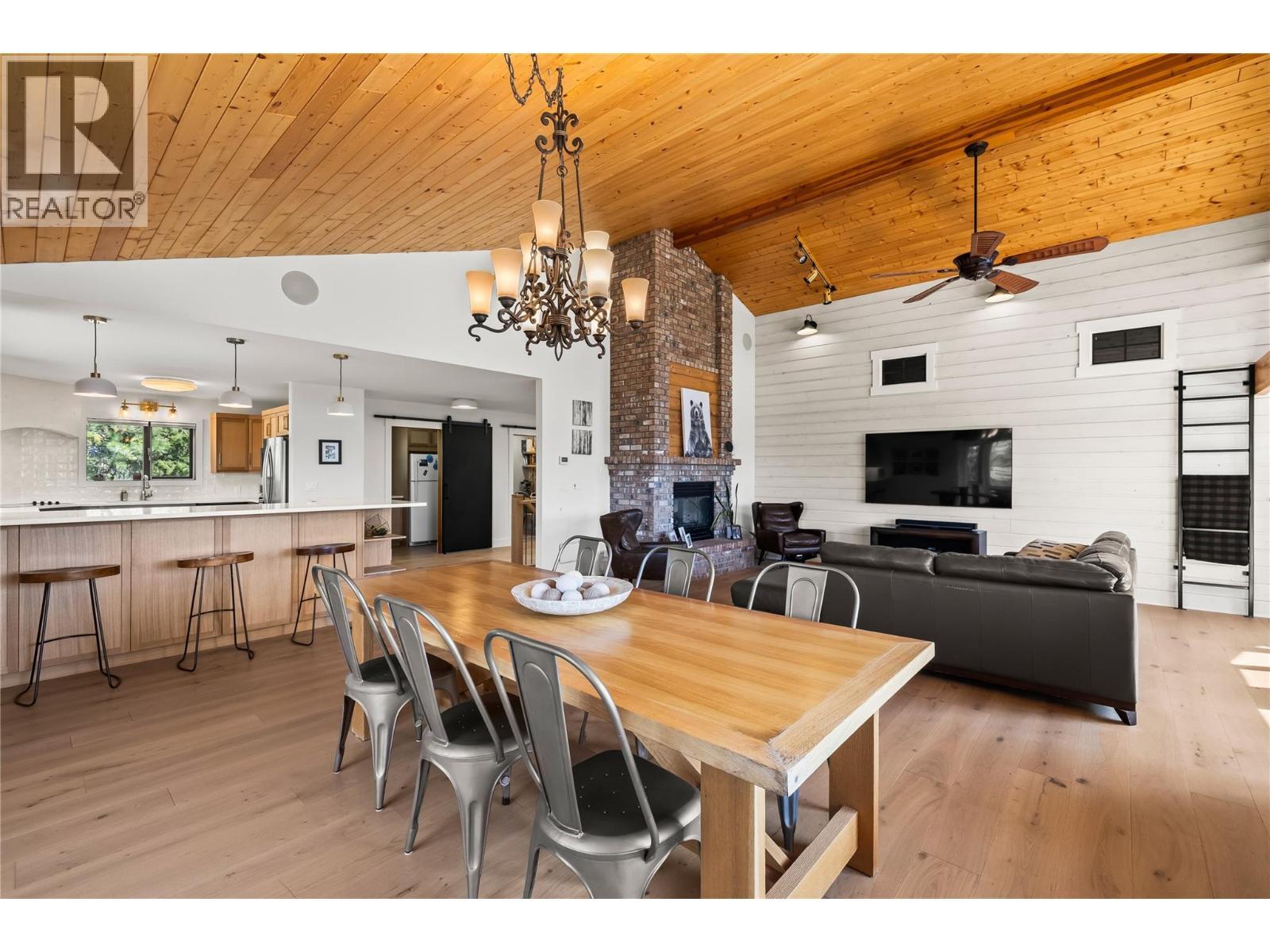 3700 Jean Road, Kelowna, BC - Indoor Photo Showing Dining Room With Fireplace