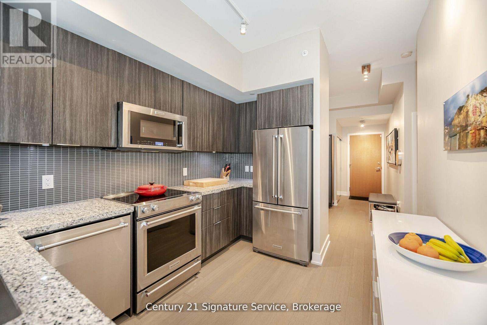 312 - 20 Shore Breeze Drive, Toronto, ON - Indoor Photo Showing Kitchen With Stainless Steel Kitchen