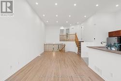 Newly refinished hardwood floors and pot lighting -