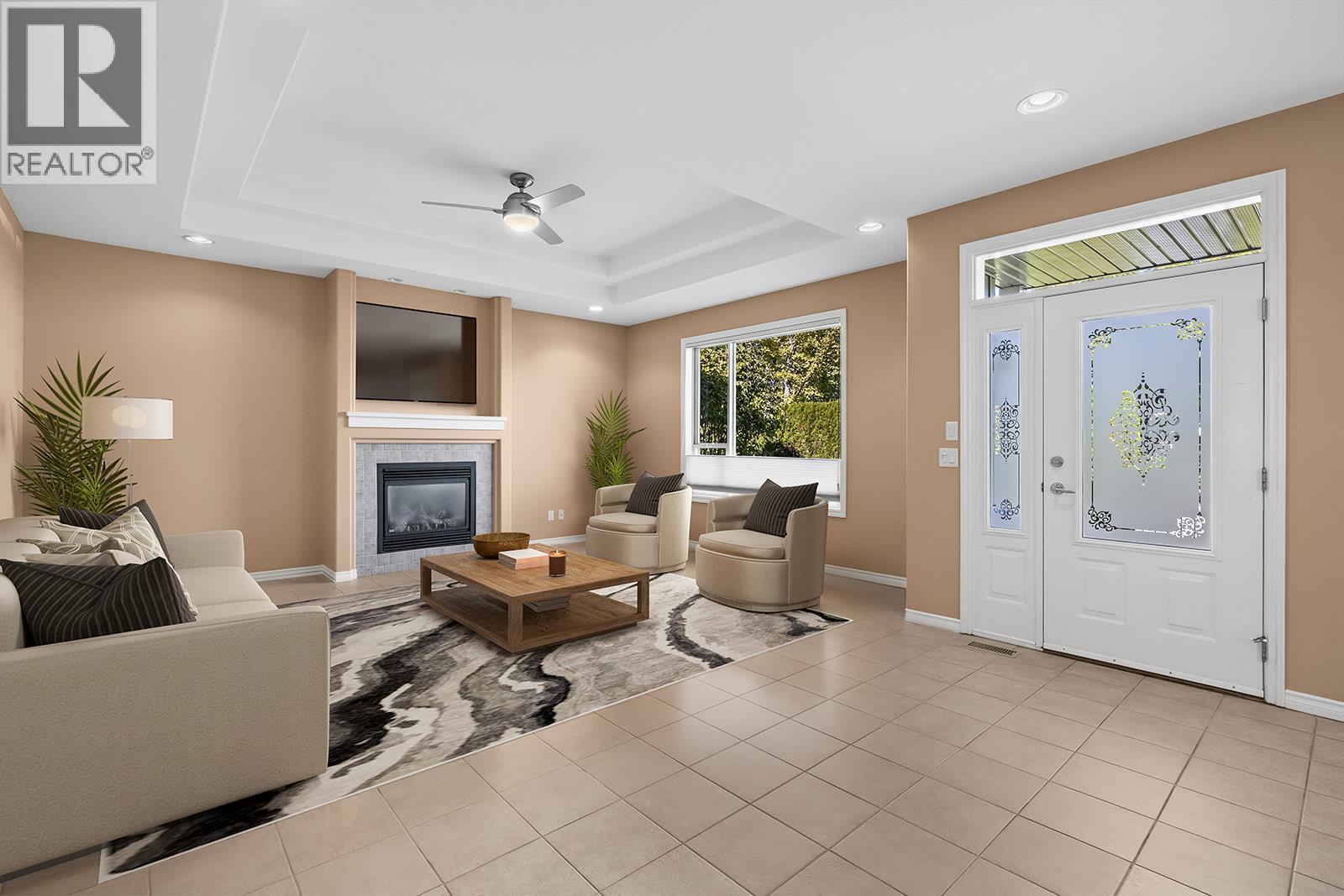 Virtually staged photo - 1405 Guisachan Place Unit# 117, Kelowna, BC - Indoor Photo Showing Living Room With Fireplace