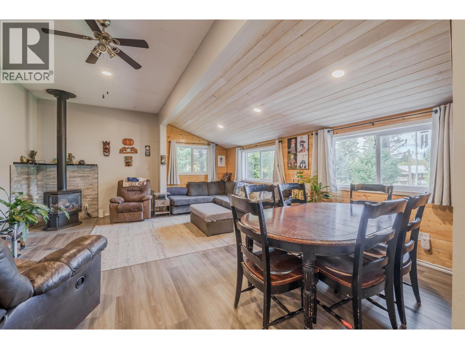 6395 Young Road, Horse Lake, BC - Indoor Photo Showing Dining Room With Fireplace
