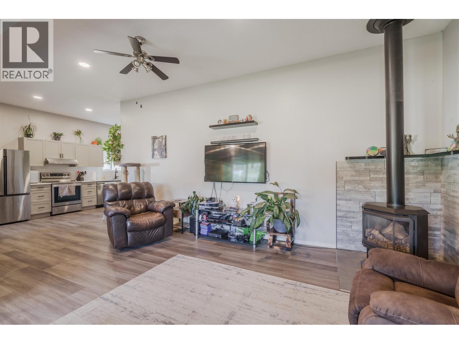 6395 Young Road, Horse Lake, BC - Indoor Photo Showing Living Room With Fireplace