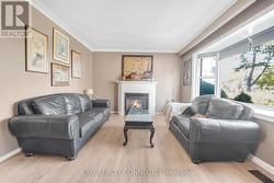 Large livingroom with fireplace and big bay window -