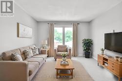 Apt B - Virtually staged living room. -