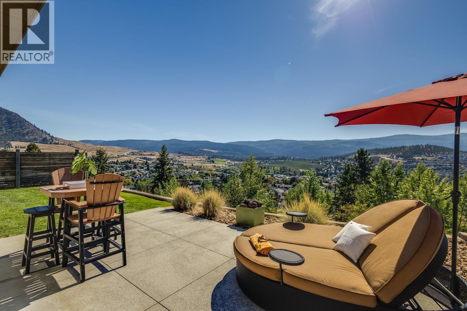 Indoor space flows effortlessly to the outdoor patio - 1040 Henderson Drive, Kelowna, BC - Outdoor With Deck Patio Veranda With View