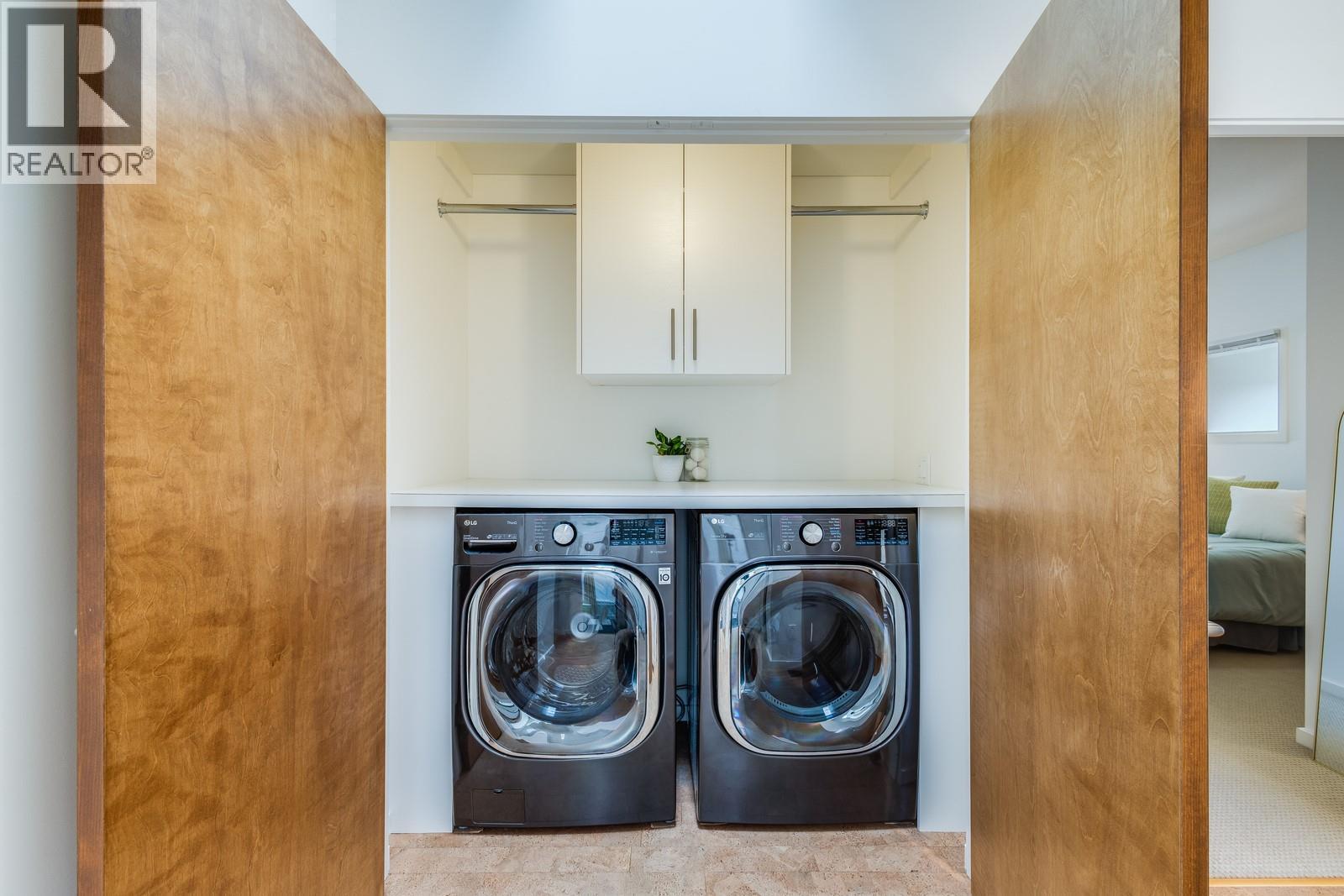Oversized closet for laundry close to all of the bedrooms - 1040 Henderson Drive, Kelowna, BC - Indoor Photo Showing Laundry Room
