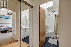 Full bathroom with a skylight on the upper level -