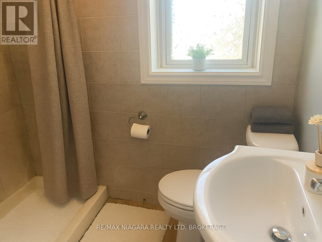 Bathroom - digitally staged - 2 - 23 Jarvis Street, Fort Erie (Central), ON