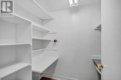 walk-in linen closet/small den with built-in desks -