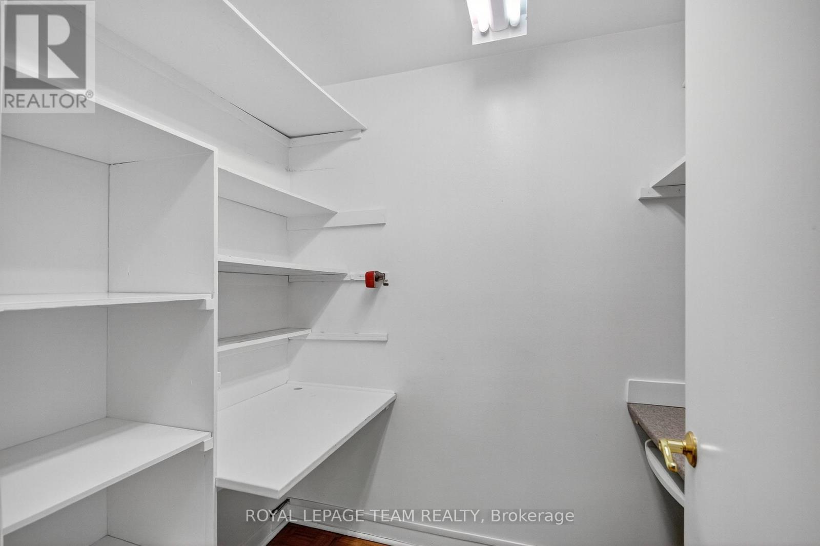 walk-in linen closet/small den with built-in desks - 1264 Morrison Drive, Ottawa, ON - Indoor With Storage