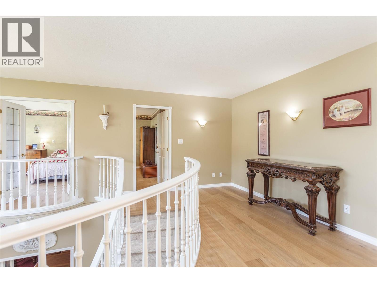 Upstairs Landing - 6655 Cosens Bay Road, Coldstream, BC - Indoor Photo Showing Other Room