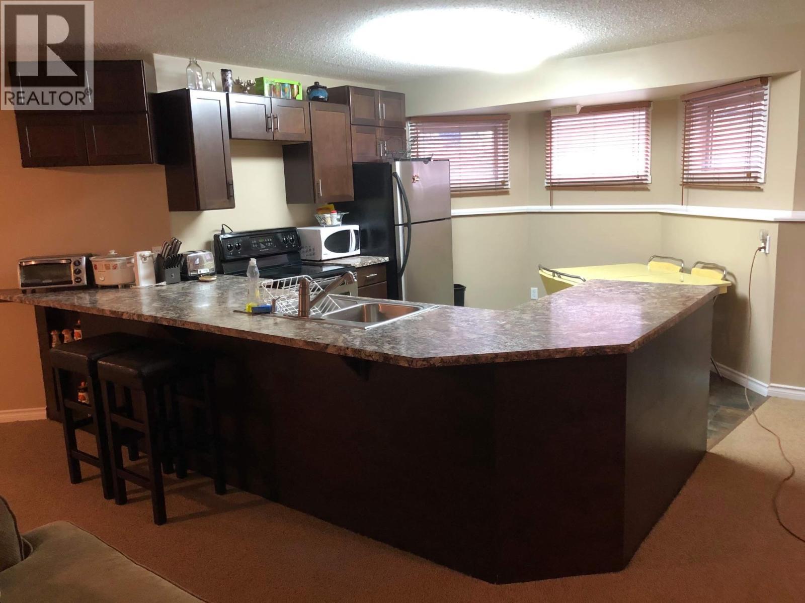 Basement Suite Kitchen - 6655 Cosens Bay Road, Coldstream, BC - Indoor Photo Showing Kitchen With Double Sink