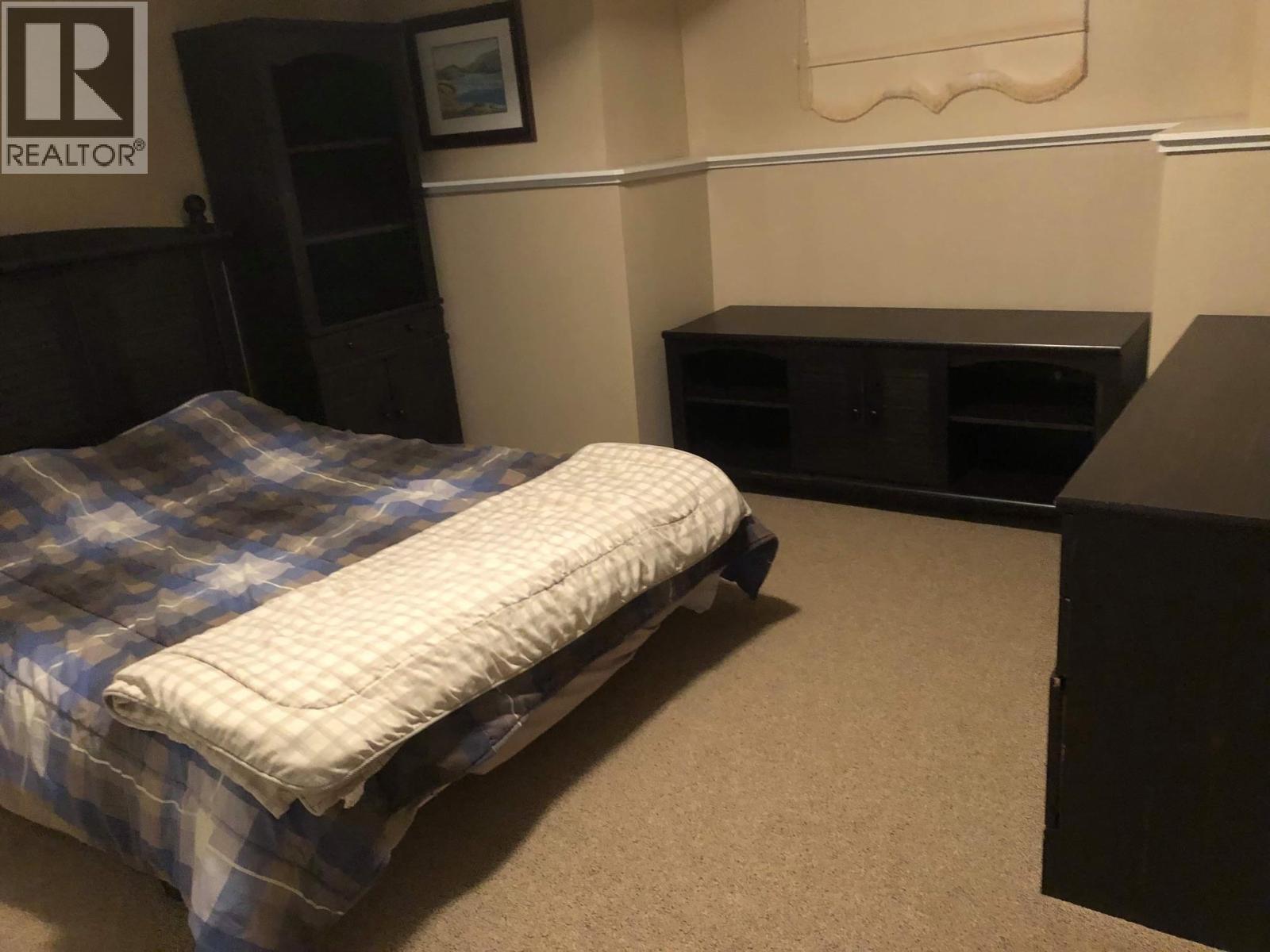 Basement Suite Bedroom - 6655 Cosens Bay Road, Coldstream, BC - Indoor Photo Showing Bedroom